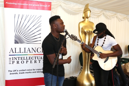 Moelogo performing at the Alliance for IP Summer Reception at the House of Commons